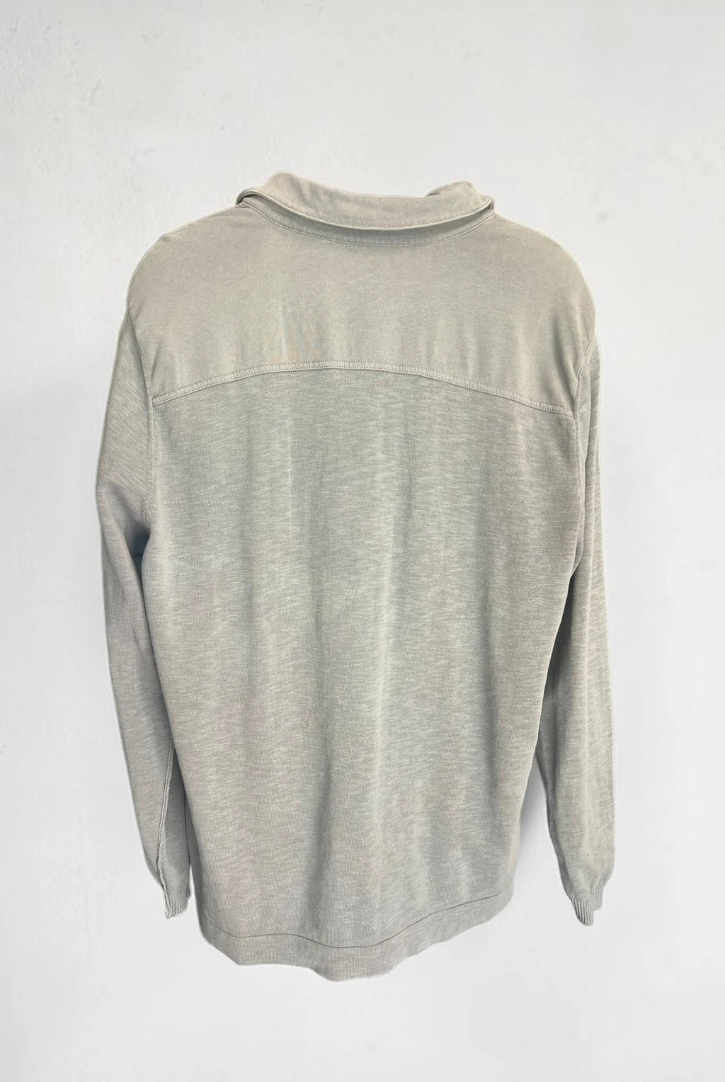 Hugo Boss grey long sleeve polo shirt with open collar and soft cotton fabric.