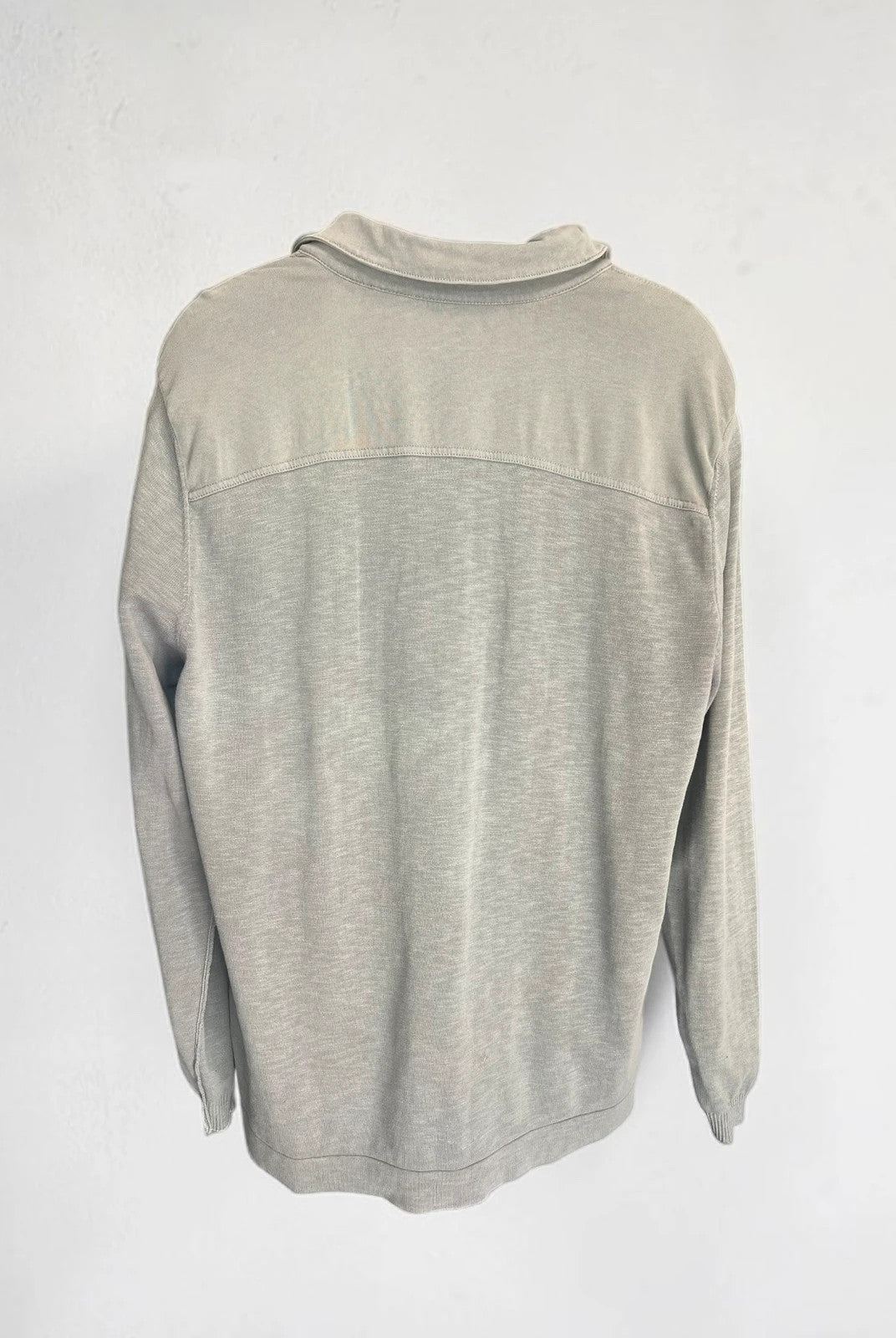 Hugo Boss grey long sleeve polo shirt with open collar and soft cotton fabric.