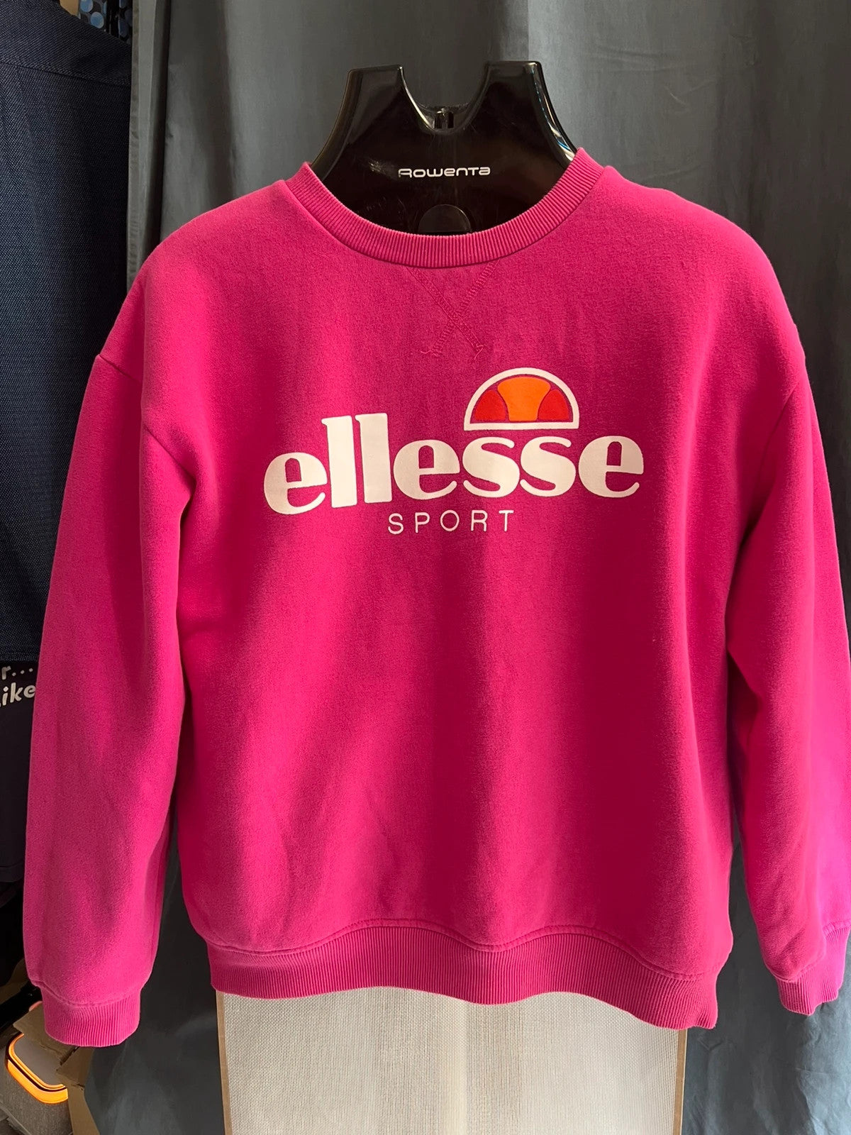 Ellesse pink sweatshirt with large printed logo on chest, soft cotton blend.