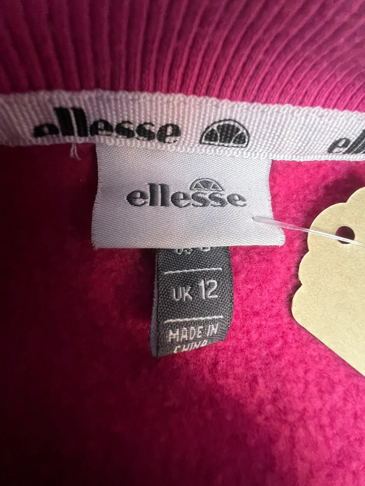 Ellesse pink sweatshirt with large printed logo on chest, soft cotton blend.