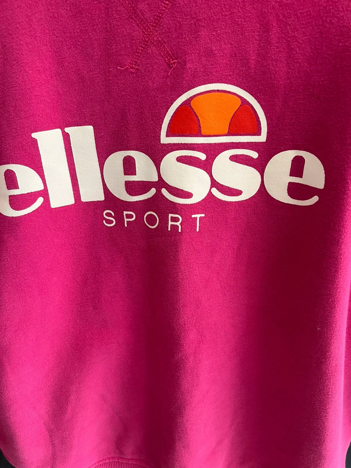 Ellesse pink sweatshirt with large printed logo on chest, soft cotton blend.