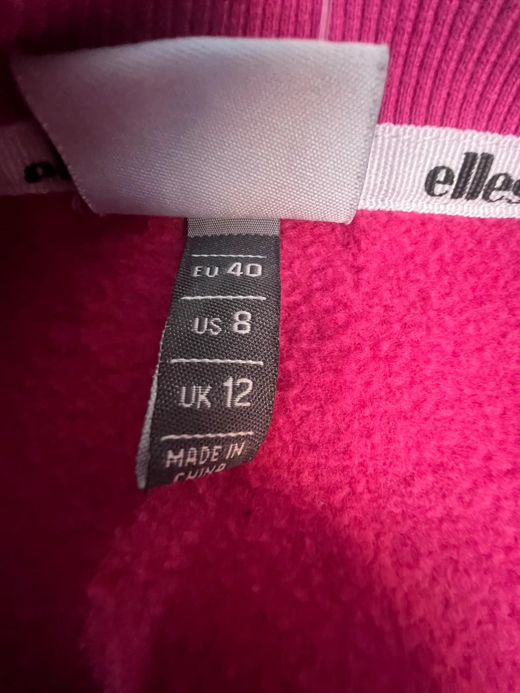 Ellesse pink sweatshirt with large printed logo on chest, soft cotton blend.