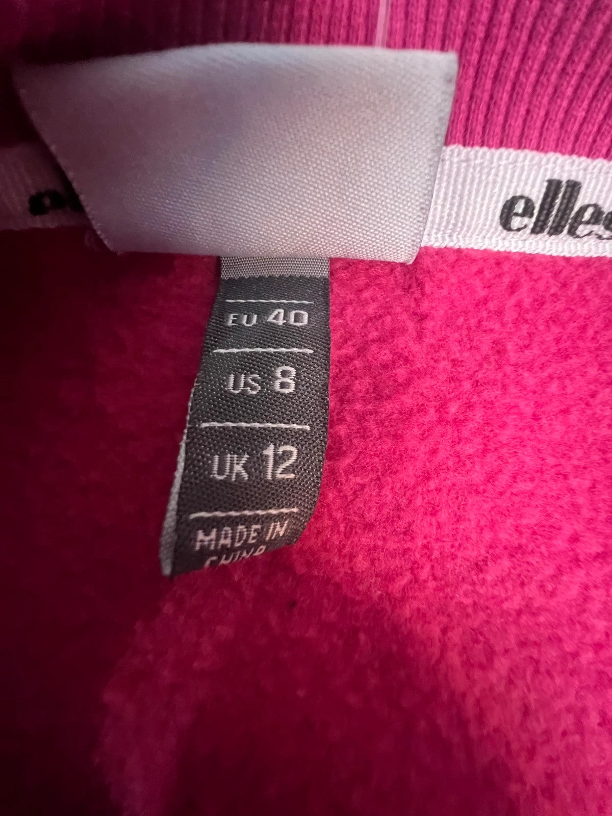 Ellesse pink sweatshirt with large printed logo on chest, soft cotton blend.