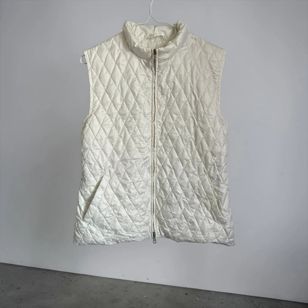 Moncler white gilet with diamond quilted pattern, high collar, and double zipper.