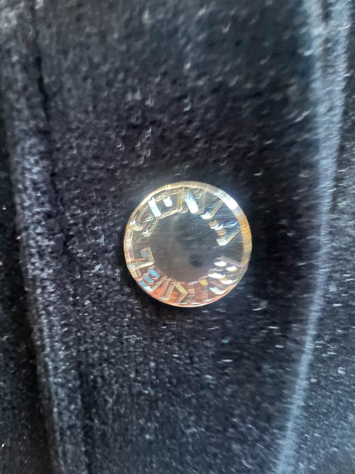 Sonia Rykiel black velvet cardigan with gold details, polo collar and metallic button closure.