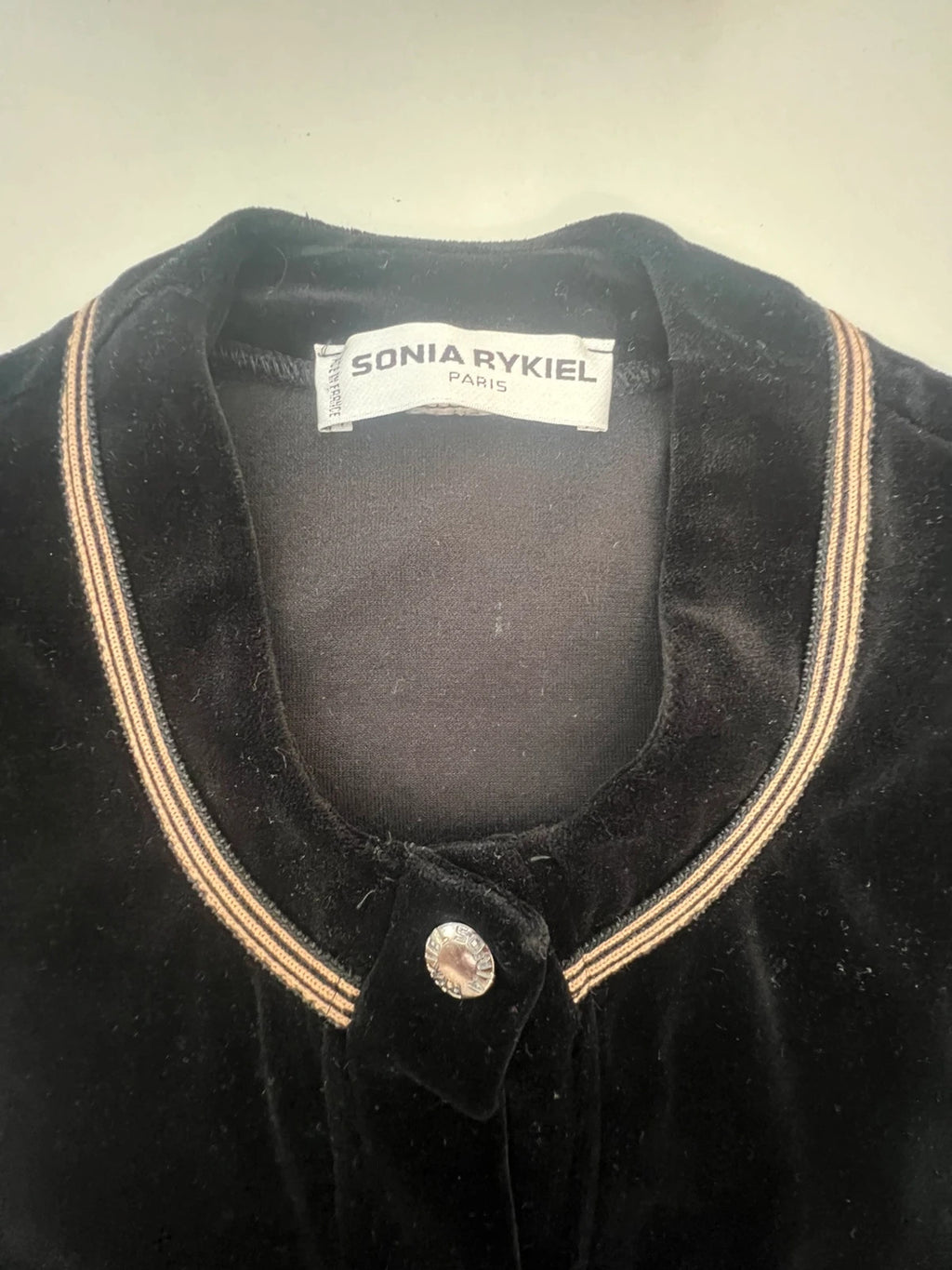 Sonia Rykiel black velvet cardigan with gold details, polo collar and metallic button closure.