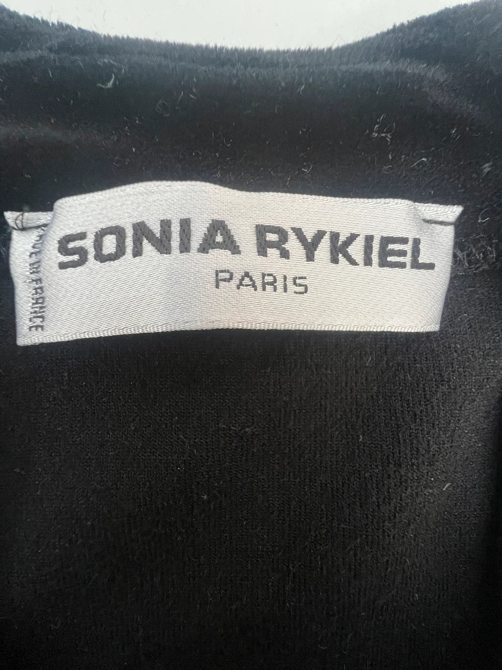 Sonia Rykiel black velvet cardigan with gold details, polo collar and metallic button closure.