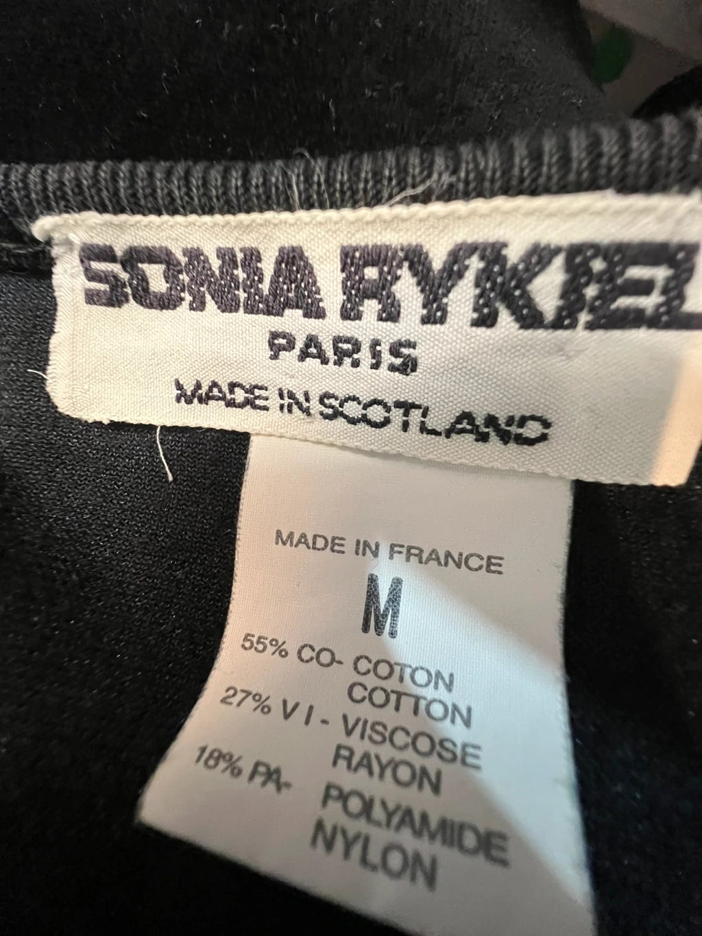 Sonia Rykiel black velour sweatshirt with beige side panels and red piping, rhinestone detail.