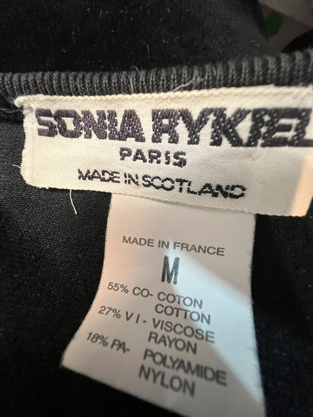 Sonia Rykiel black velour sweatshirt with beige side panels and red piping, rhinestone detail.