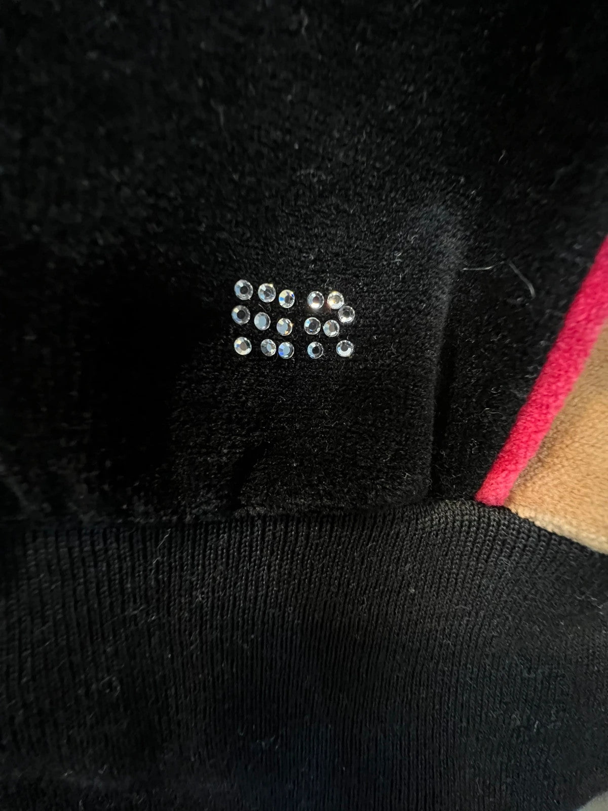 Sonia Rykiel black velour sweatshirt with beige side panels and red piping, rhinestone detail.
