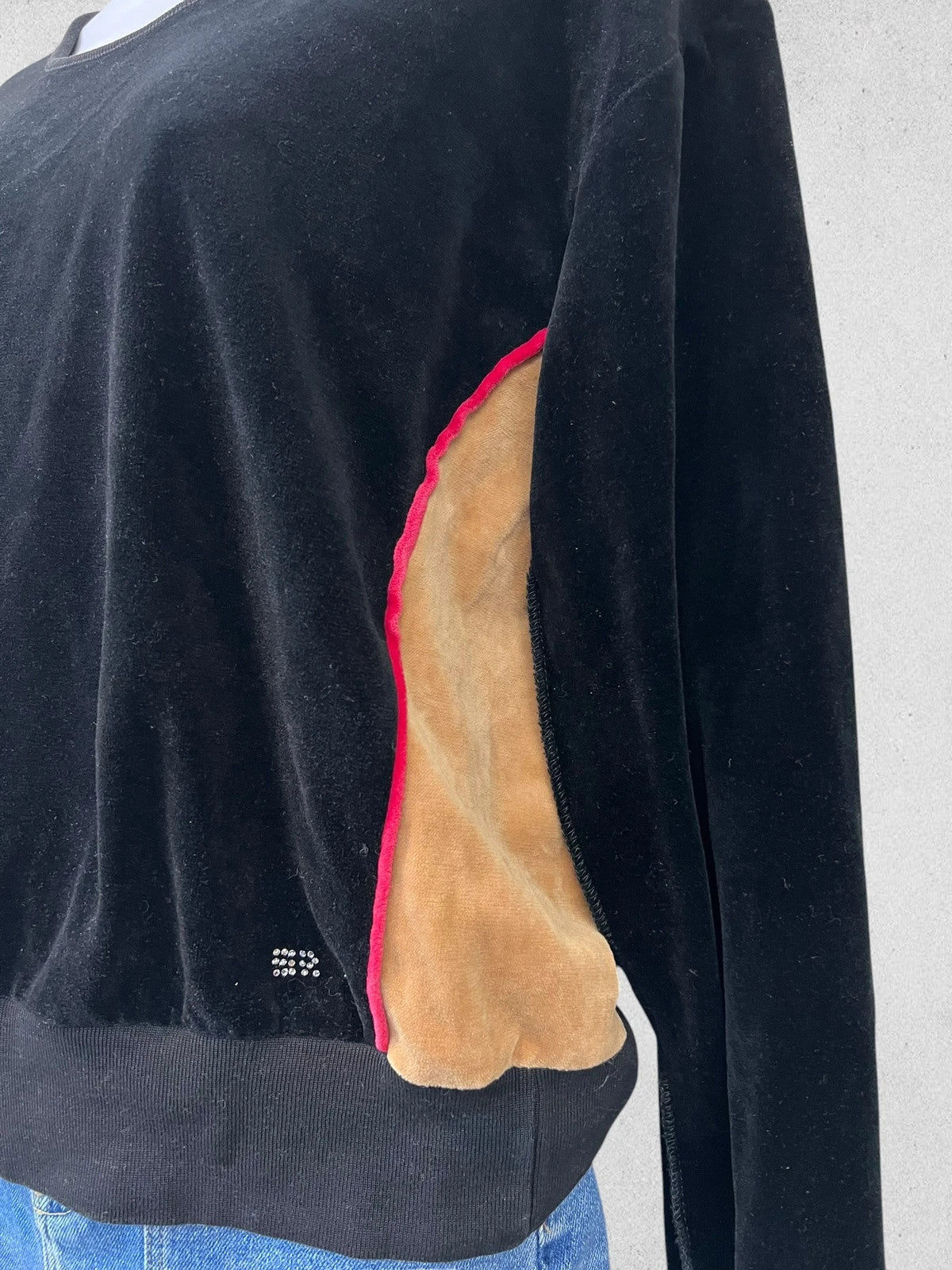 Sonia Rykiel black velour sweatshirt with beige side panels and red piping, rhinestone detail.