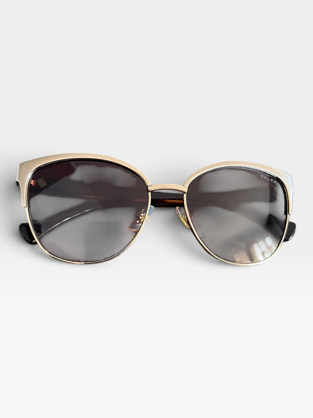 Ralph Lauren Cat Eye sunglasses brown lenses gold and brown frame with logo details.